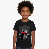 Child wearing a black t-shirt with a motorcycle graphic and 'Just Ride' text on a white background