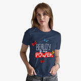 A woman wearing a navy blue crew neck t-shirt with the text 'BEAUTY is my POWER' printed on the front, paired with jeans.