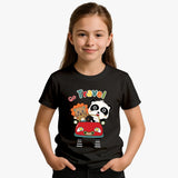 Child wearing a black t-shirt with cartoon characters and 'Go Travel!' text on a plain background