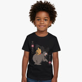 Child wearing a black t-shirt with a graphic design of Mowgli and Baloo from Disney's The Jungle Book.