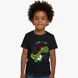 Child wearing a black t-shirt with a dinosaur graphic and colorful text on a white background