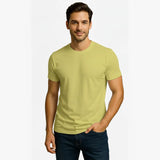 Man wearing a light green t-shirt on a white background
