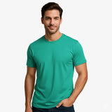 Man wearing a teal t-shirt against a plain background