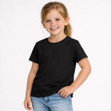 Young girl wearing a black t-shirt and blue jeans on a white background