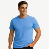 Man wearing a blue t-shirt against a plain background