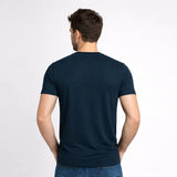 Man wearing a navy blue t-shirt on a white background