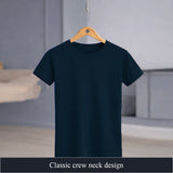Navy blue t-shirt on a wooden hanger against a neutral background